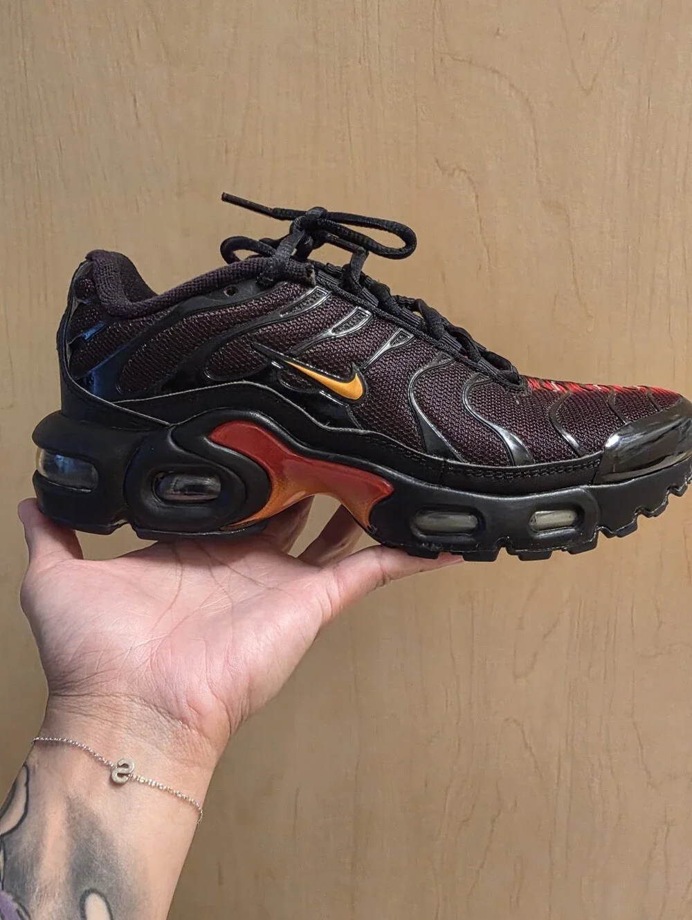 Nike Air Max Plus Black with Red and Yellow Accents